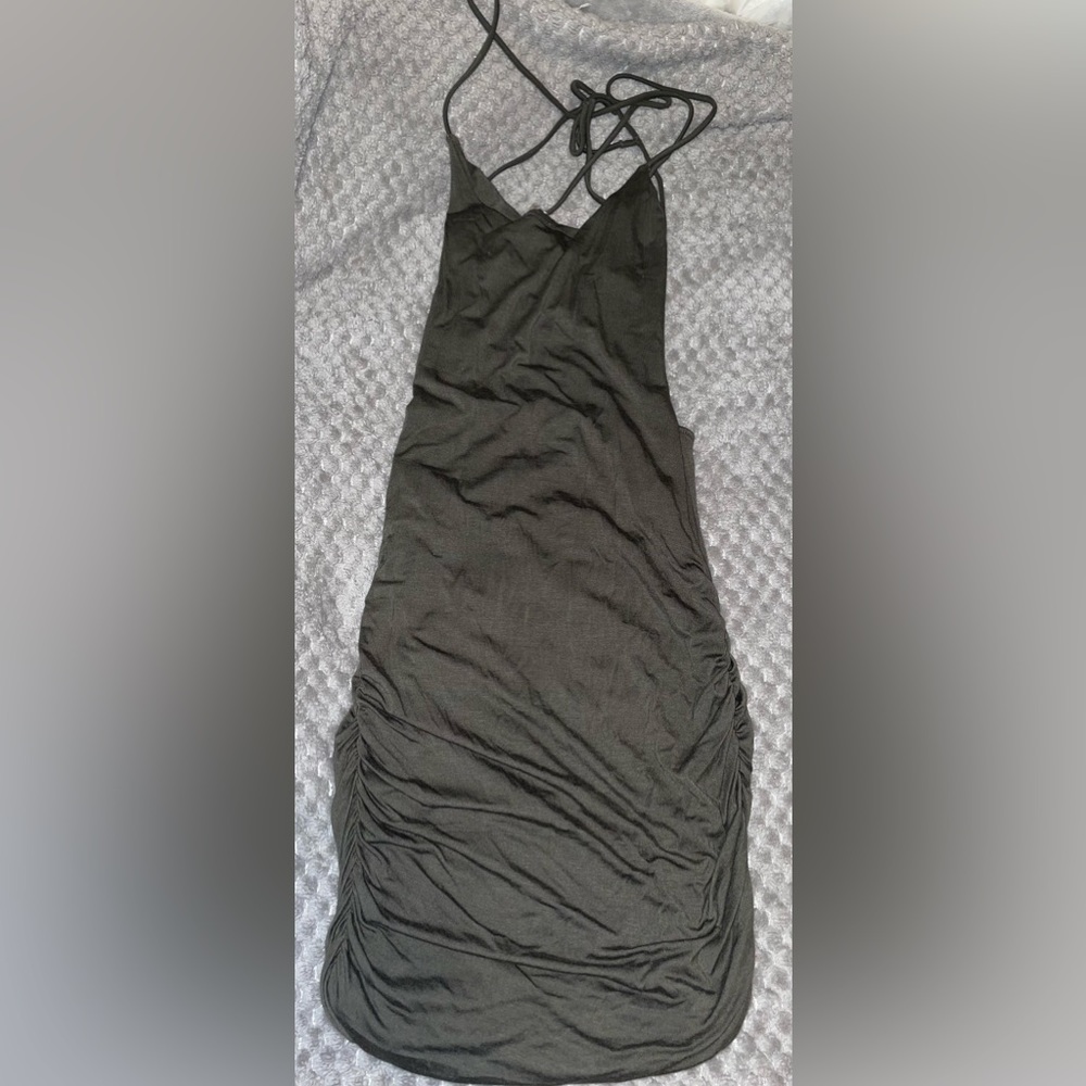 Open back, tight,short, and dark green dress